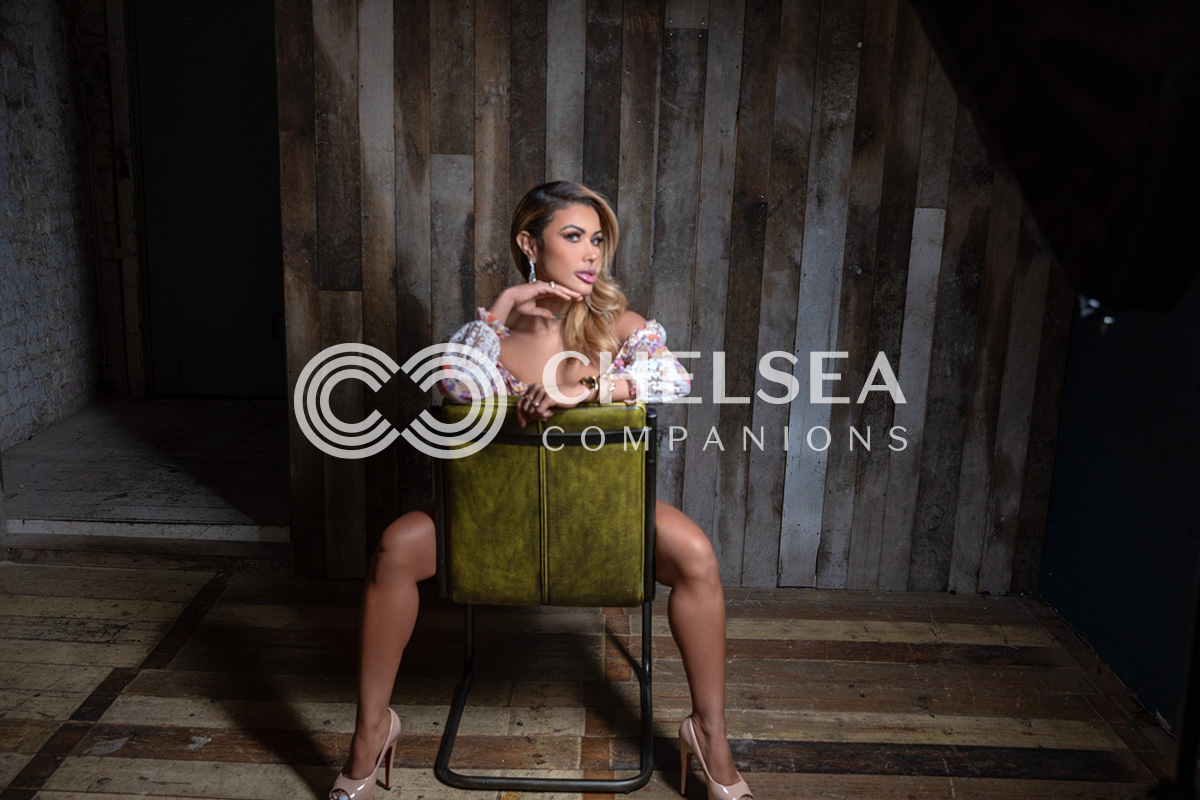 Cris Galera straddling a chair